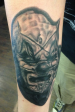 Black and grey slipknot clown portrait tattoo